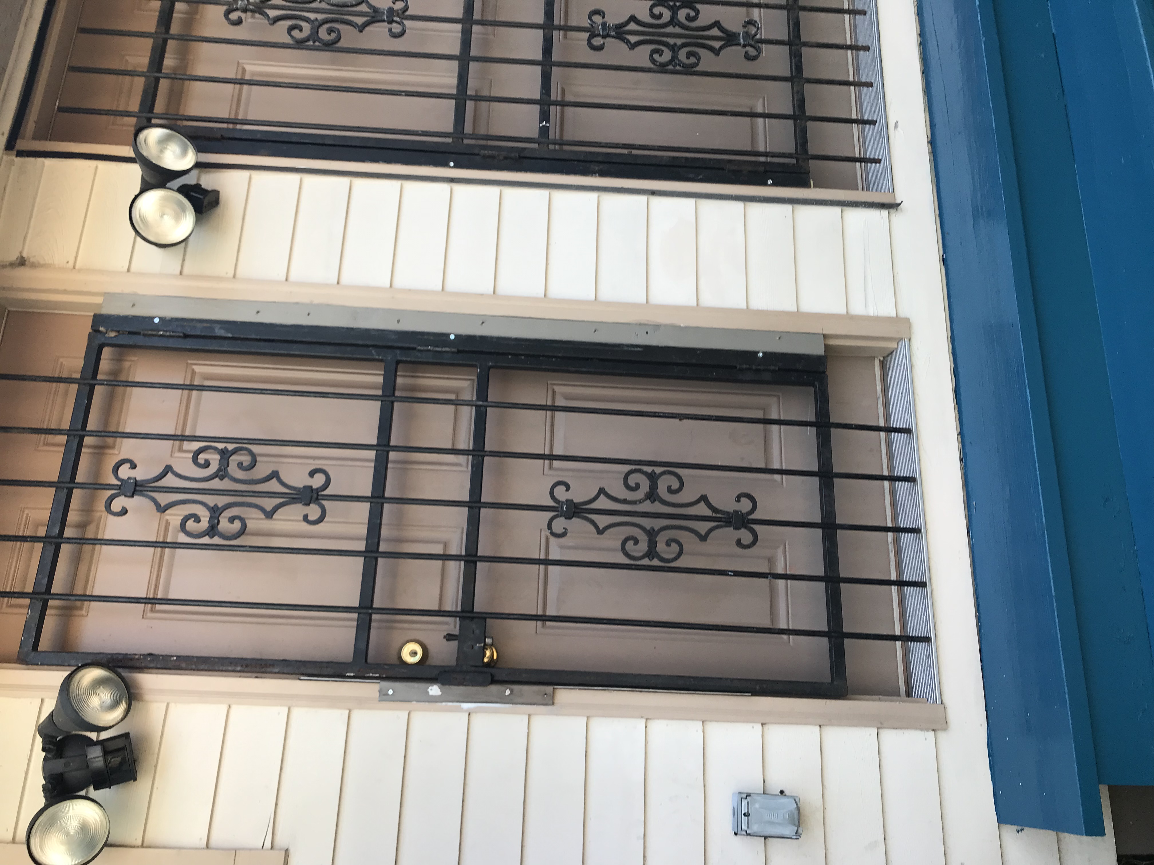 Decorative iron security doors with fresh paint