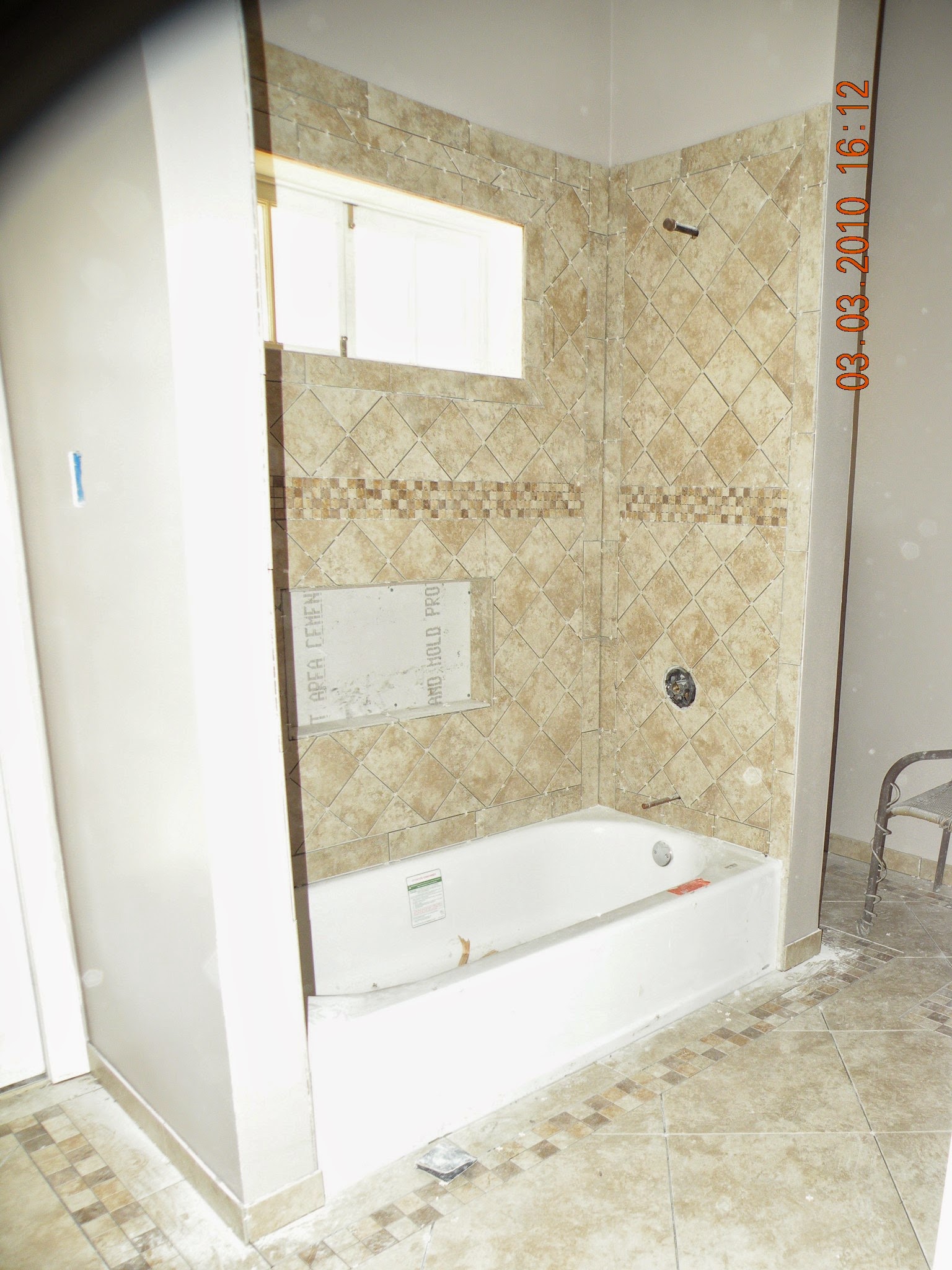 Finished bathroom with diamond tile